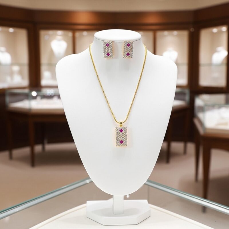 Ruby Accent Rectangle Pendant Set beautifully presented on white display bust showing full necklace and earrings