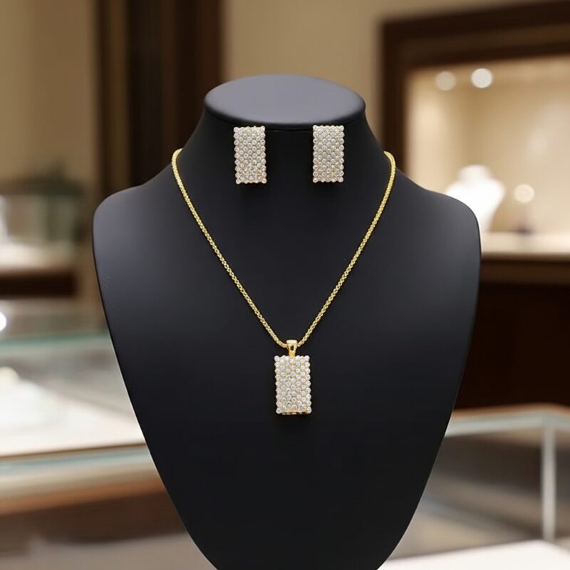 Sparkling Rectangle Pendant Set displayed on black jewelry bust showing the complete necklace and earrings set