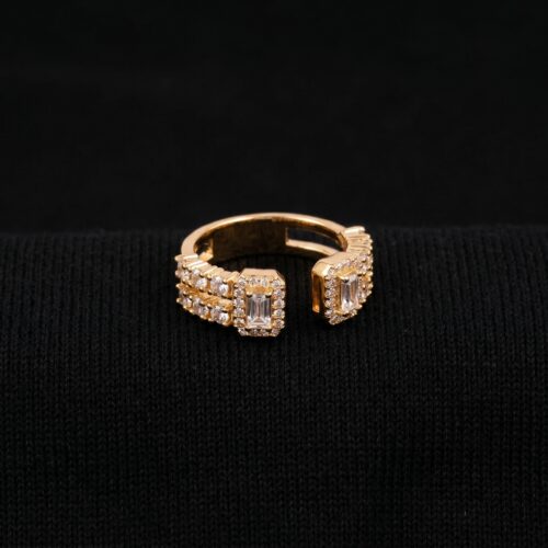 StudioShot Studio shot of Double Baguette Brilliance Cuff Ring on black background highlighting two baguette stones, pavé details, and rich gold finish