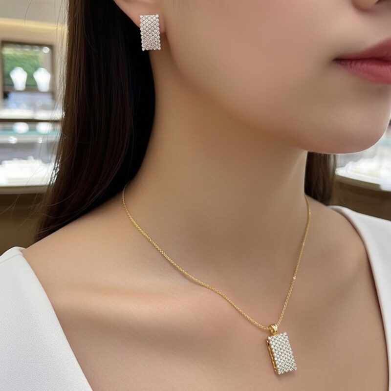 Beautiful woman wearing Sparkling Rectangle Pendant Set showing the necklace and one earring with soft elegant look