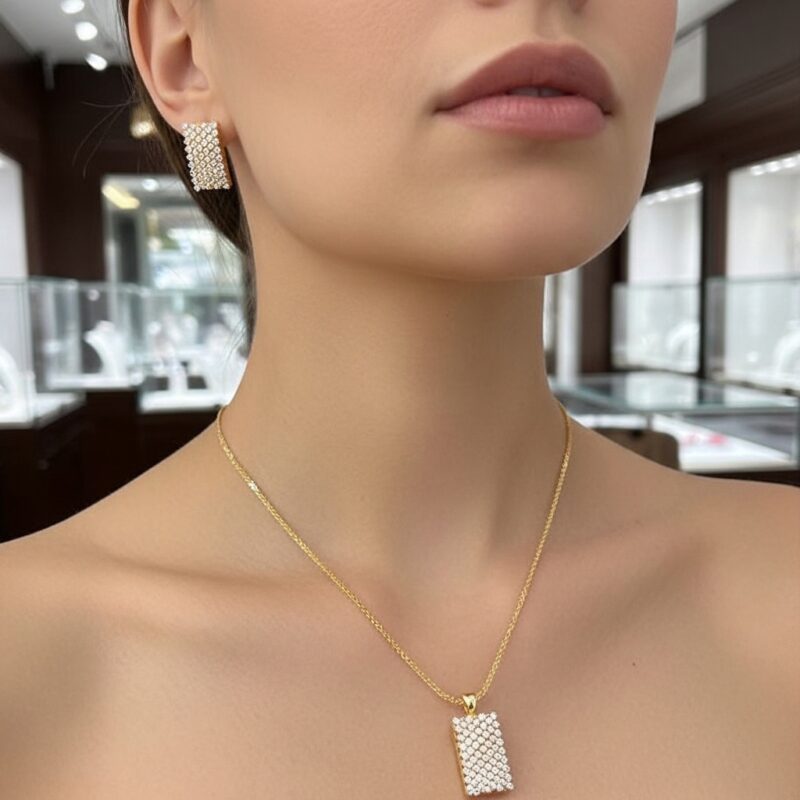 Close-up of woman wearing Sparkling Rectangle Pendant Set highlighting the sparkling rectangular pendant and matching earring