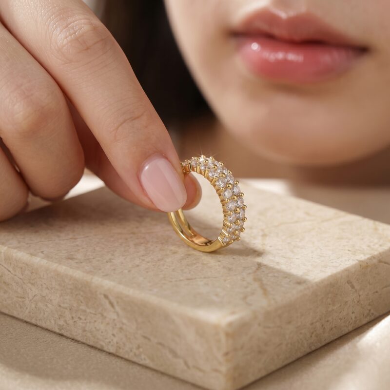 Hand holding Double Row Brilliance Adjustable Ring showing the sparkling round stones and comfortable adjustable open style