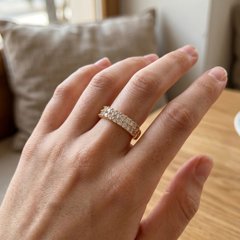 Beautiful hand wearing Double Row Brilliance Adjustable Ring on finger showing the double row of sparkling stones in natural light
